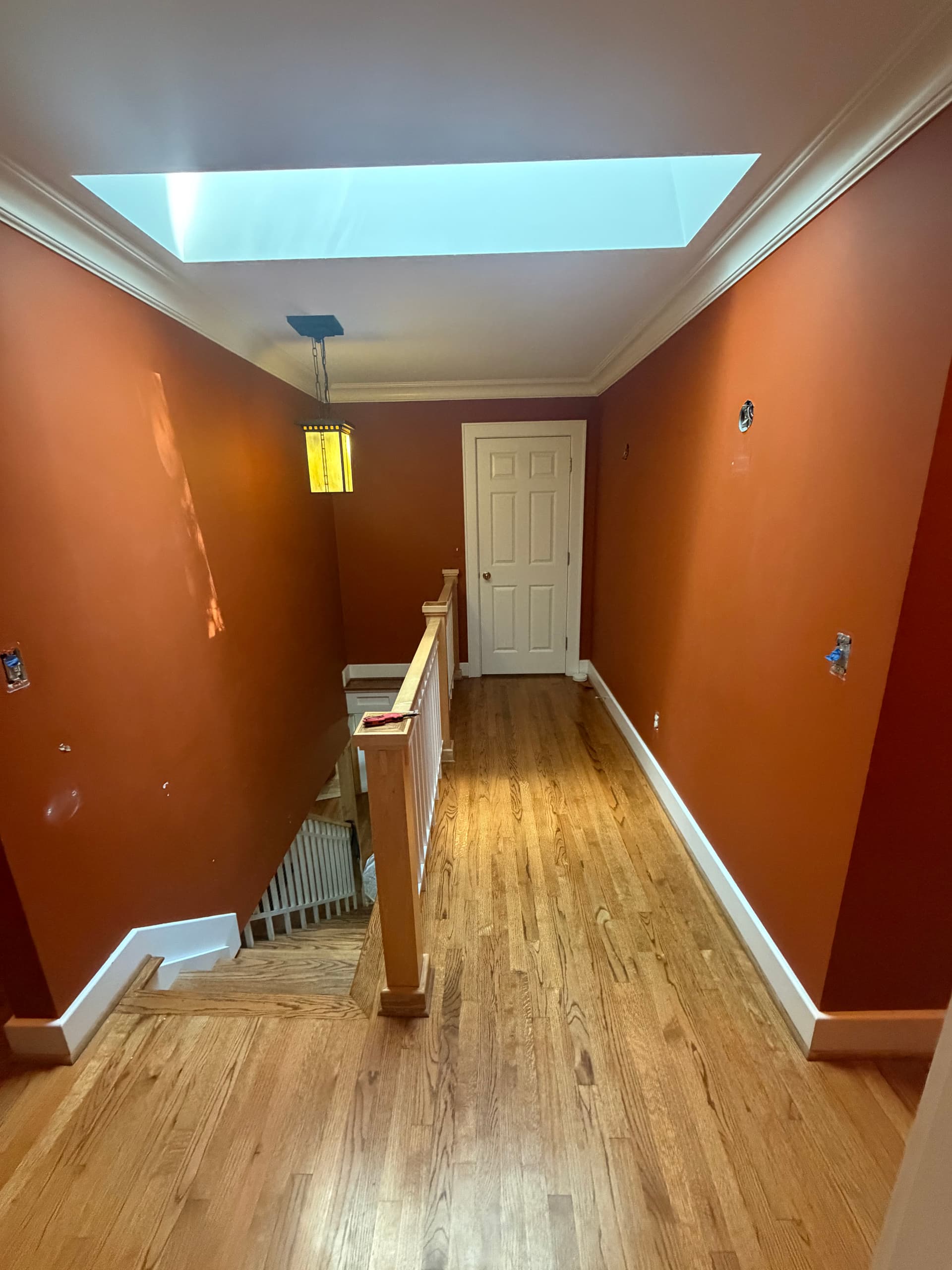 Upstairs Hallway Goes From Dark and Heavy to Bright and Clean image